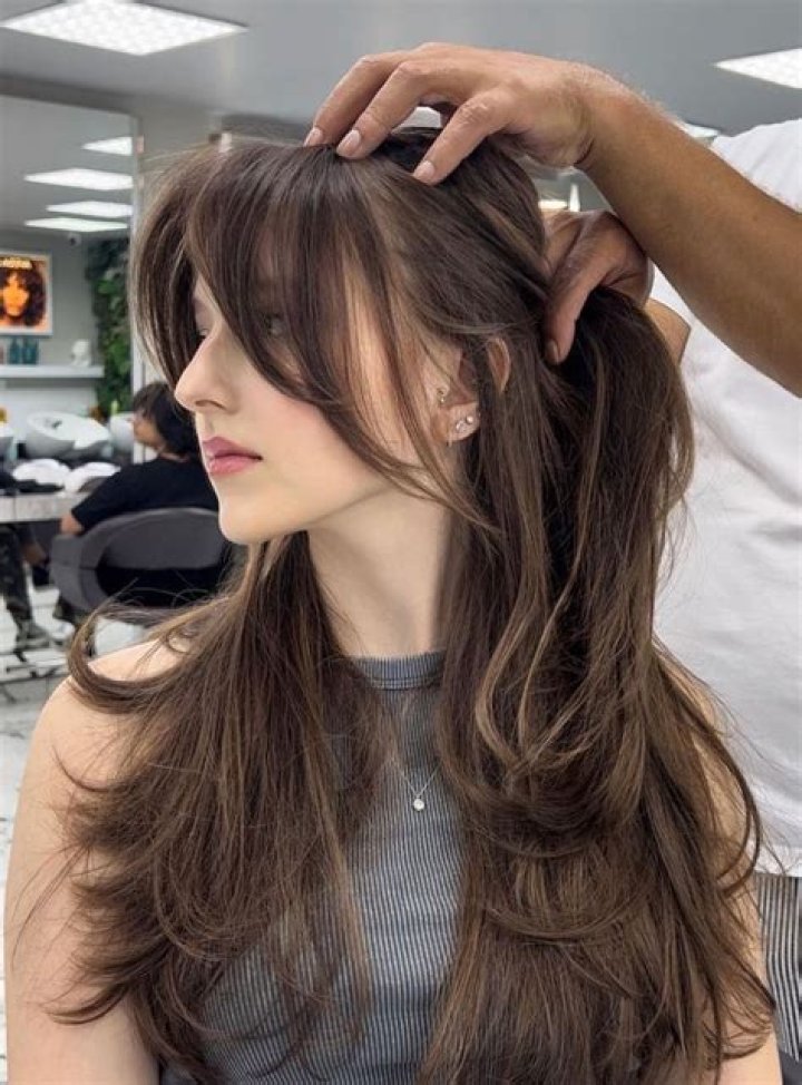 The Allure of Curtain Bangs for Long Hair: A Stylish Transformation